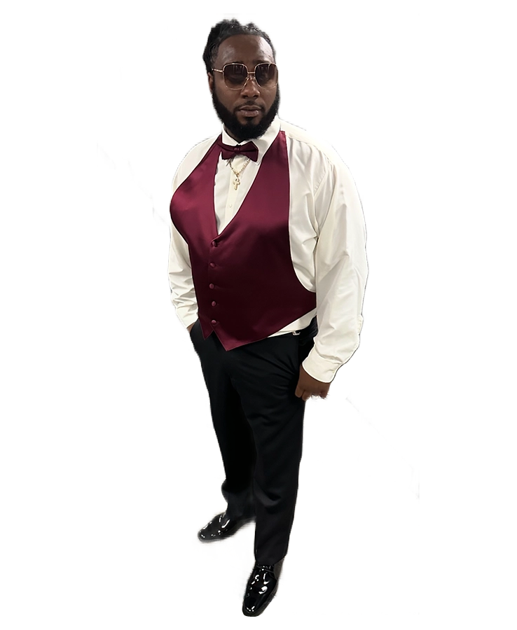 Man dressed formally with a burgundy vest and bow tie.
