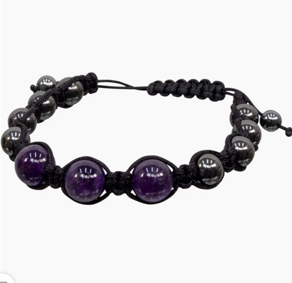 Black and purple beaded bracelet with adjustable cord.