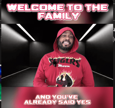 Man in red hoodie with welcoming text.